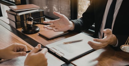 Man in legal setting explaining contract